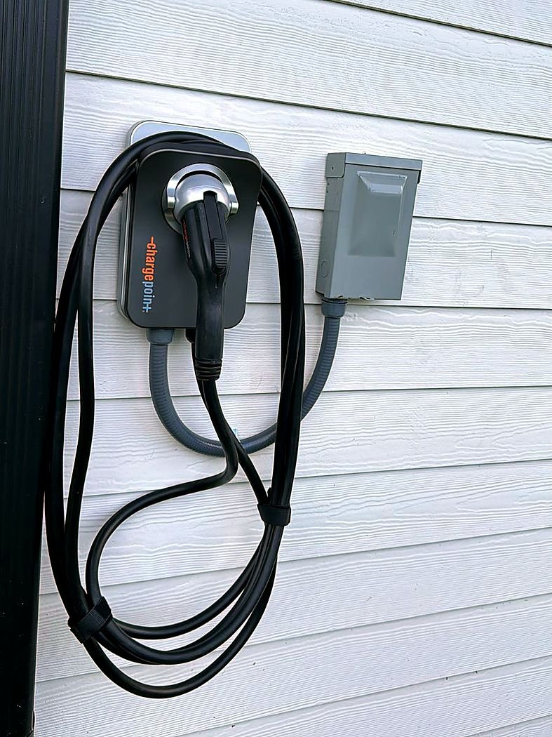 ChargePoint home charger on house siding with outdoor disconnect