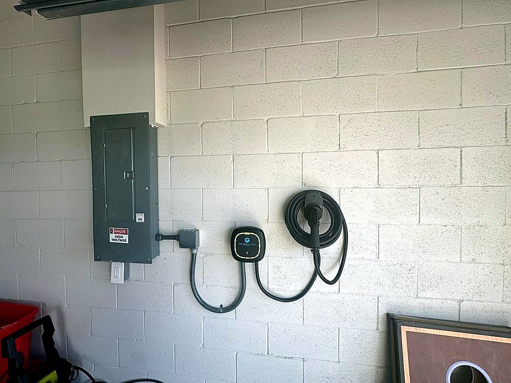 Level 2 home EV charger installed next to the panel