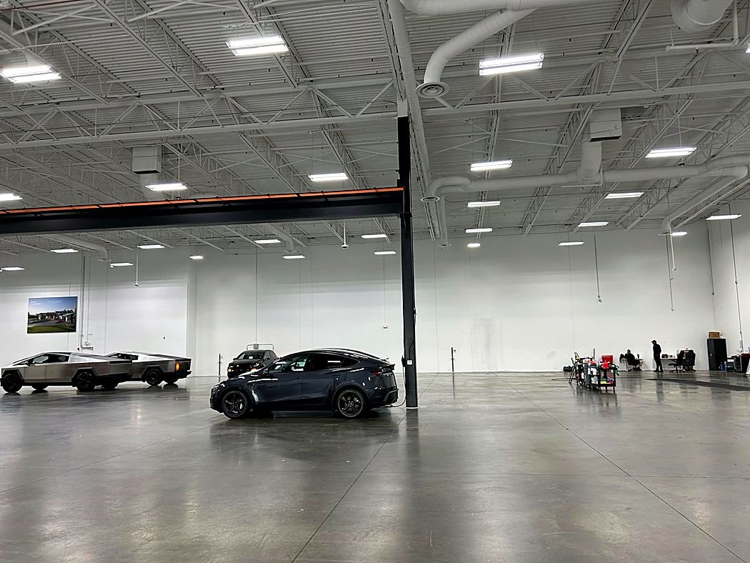 LED high-bay lights over a vehicle service floor