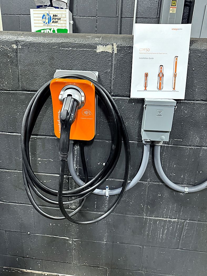 ChargePoint charger with disconnect on a block wall