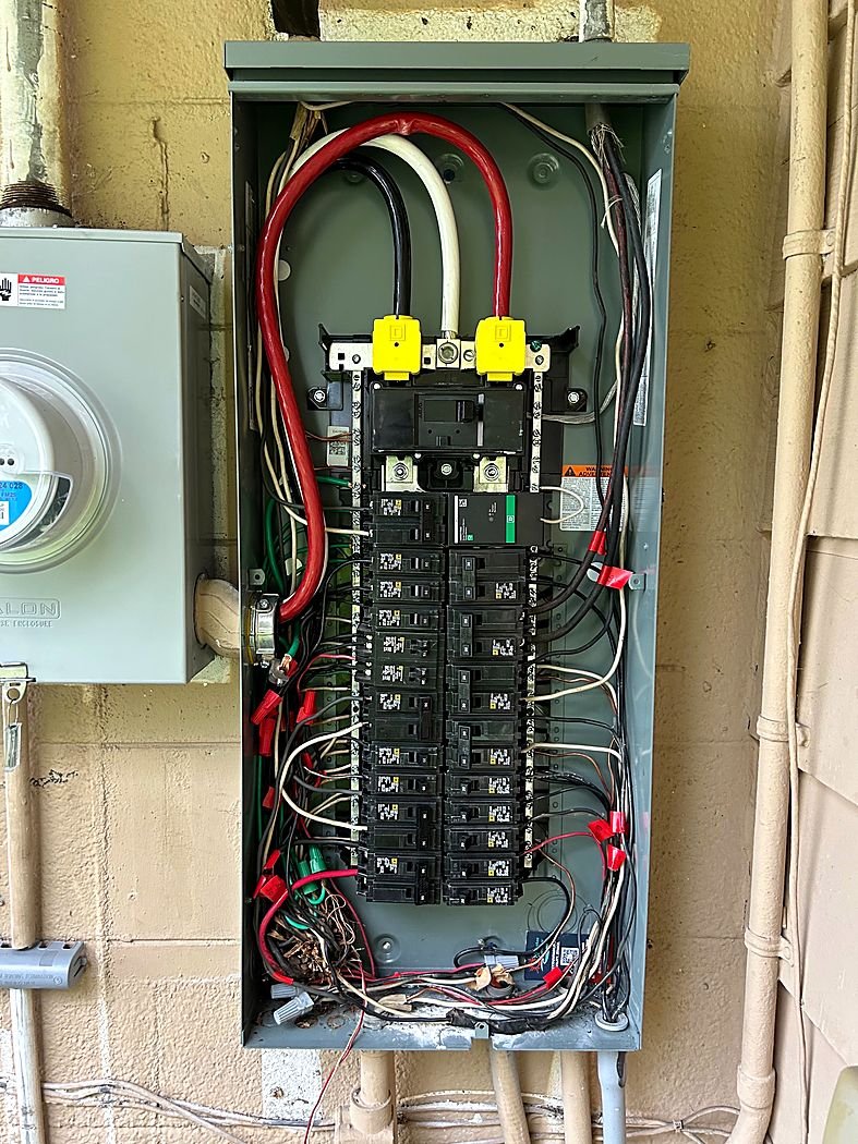 Outdoor panel with new breakers next to the meter