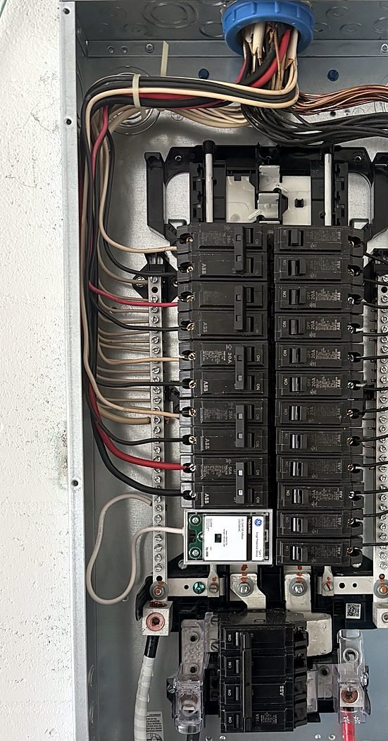 Residential panel with new breakers, neat wiring and a whole-home surge protector
